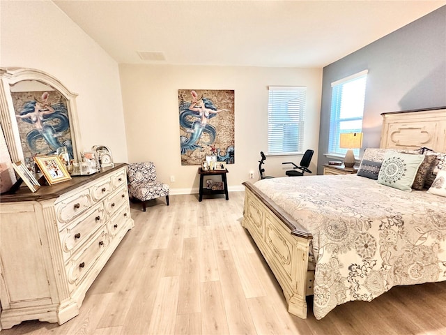 bedroom with light wood-type flooring