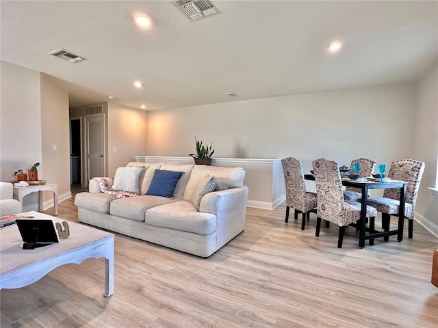 living room with light hardwood / wood-style floors