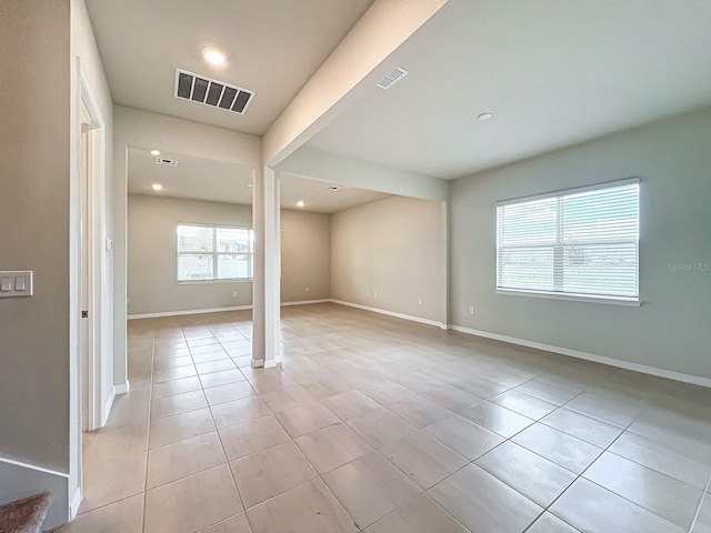 spare room with light tile patterned floors