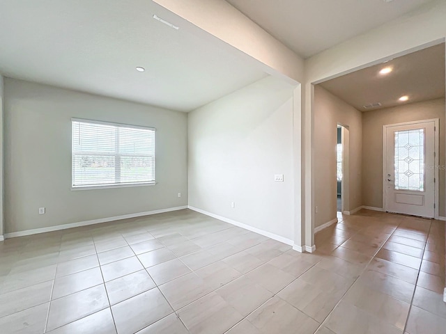 tiled foyer entrance featuring a healthy amount of sunlight