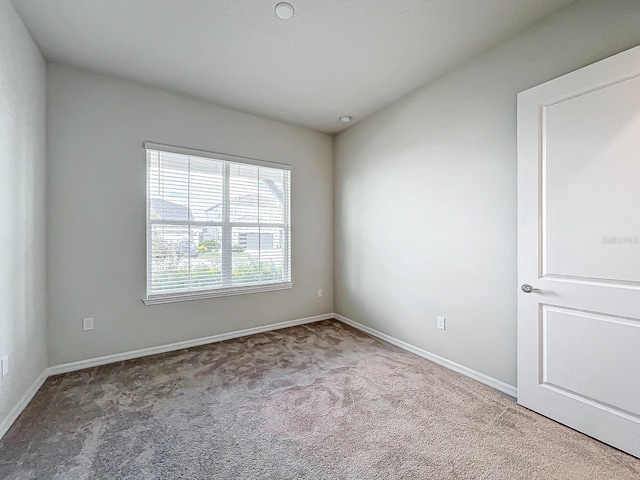 empty room with light colored carpet