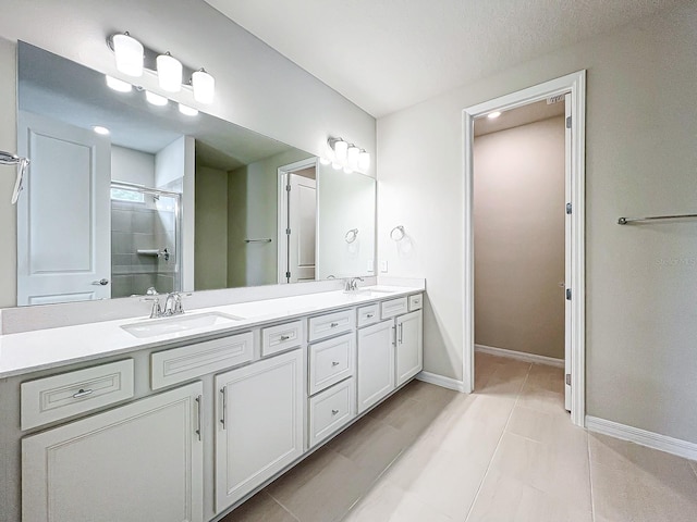 bathroom with vanity, walk in shower, and tile patterned flooring