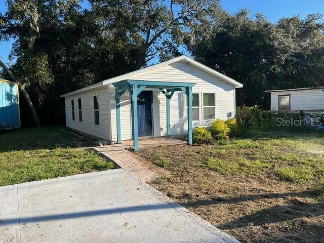 bungalow with a front lawn