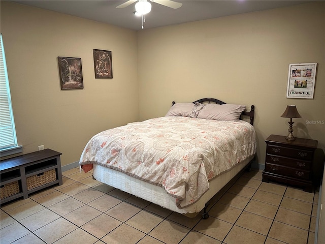 bedroom with light tile patterned floors and ceiling fan