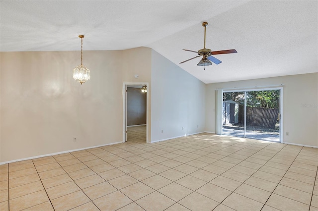 tiled empty room with a textured ceiling, lofted ceiling, and ceiling fan with notable chandelier