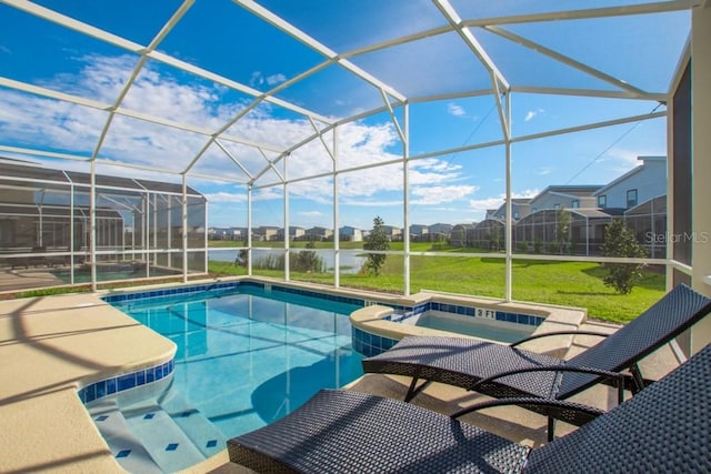 view of swimming pool with a patio, an in ground hot tub, a lawn, and glass enclosure