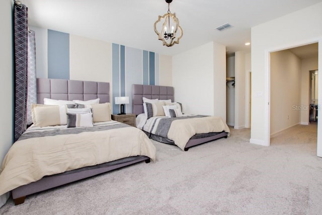 carpeted bedroom featuring an inviting chandelier