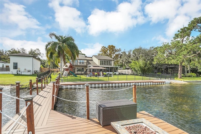 dock area featuring a yard and a water view