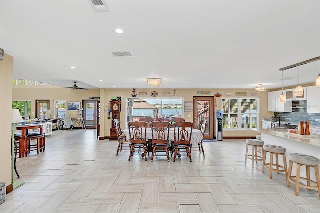 dining room with a healthy amount of sunlight and ceiling fan