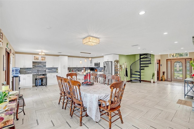 dining space featuring light parquet floors