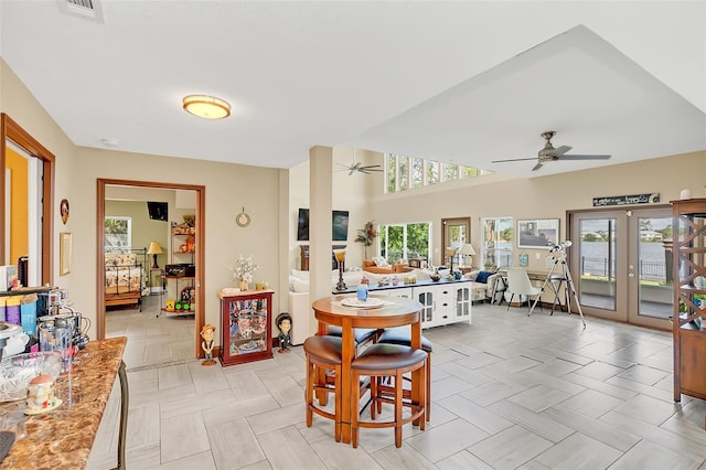 dining room with french doors and ceiling fan