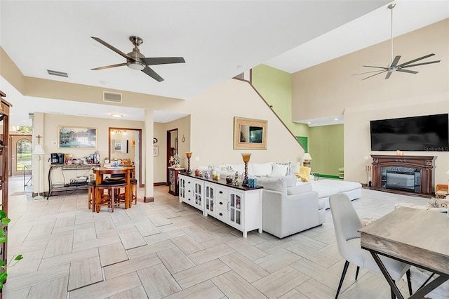 living room featuring light parquet flooring and ceiling fan