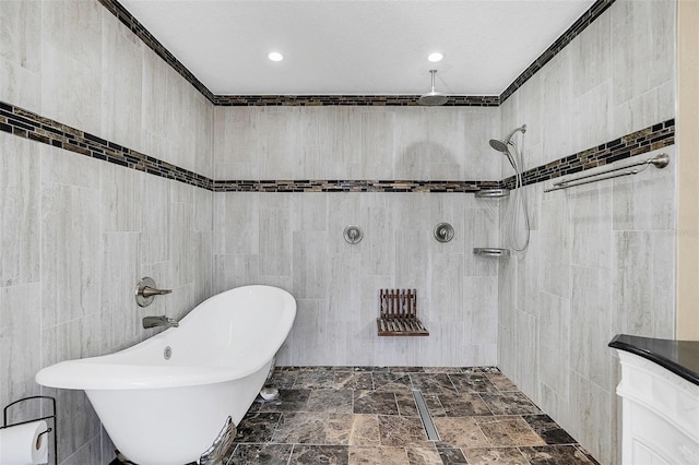 bathroom featuring a textured ceiling, independent shower and bath, tile walls, vanity, and crown molding