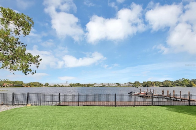 view of yard featuring a boat dock and a water view