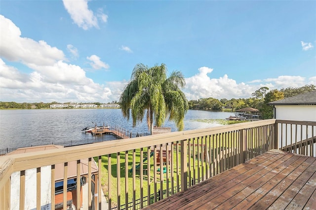 deck with a dock and a water view