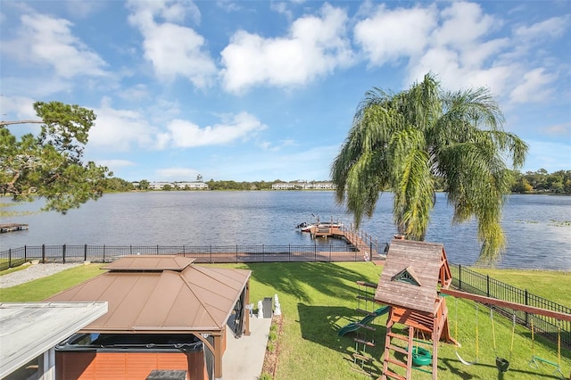 exterior space featuring a water view and a lawn