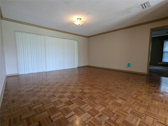 unfurnished room featuring ornamental molding, a textured ceiling, and parquet floors