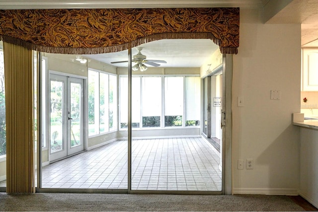 interior space featuring french doors and ceiling fan