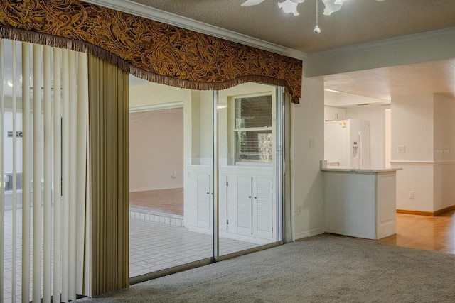 empty room with crown molding and light colored carpet