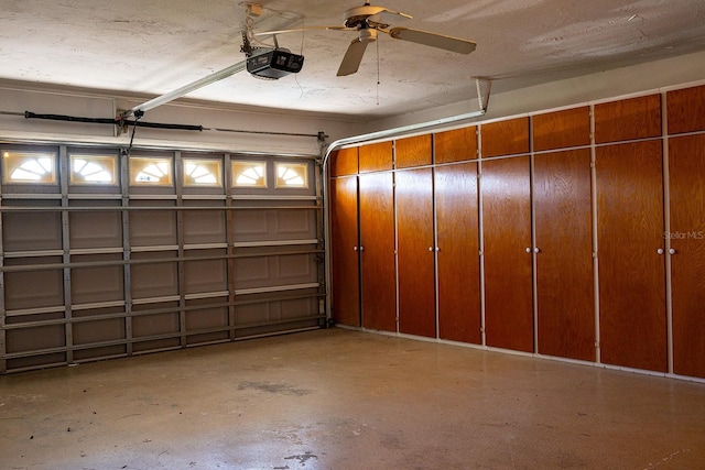 garage with ceiling fan and a garage door opener