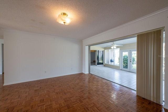 unfurnished room featuring dark parquet flooring, crown molding, a textured ceiling, and french doors