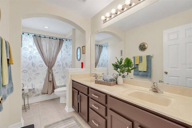 full bathroom featuring a textured ceiling, toilet, vanity, shower / tub combo with curtain, and tile patterned flooring