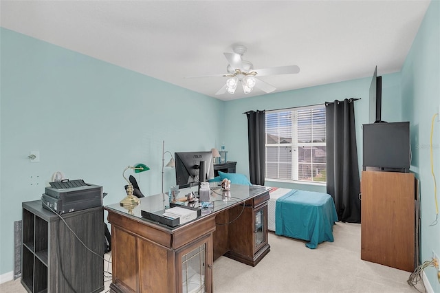 carpeted office featuring ceiling fan