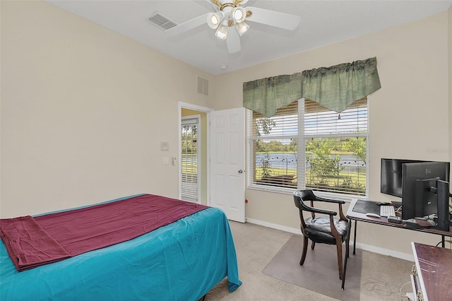 carpeted bedroom featuring ceiling fan