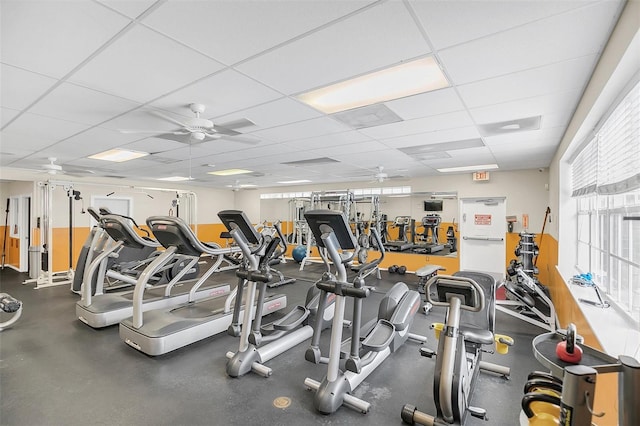 exercise room featuring a drop ceiling and ceiling fan