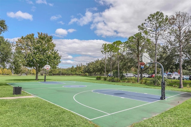 view of sport court featuring a yard