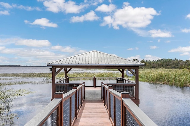 dock area with a gazebo and a water view