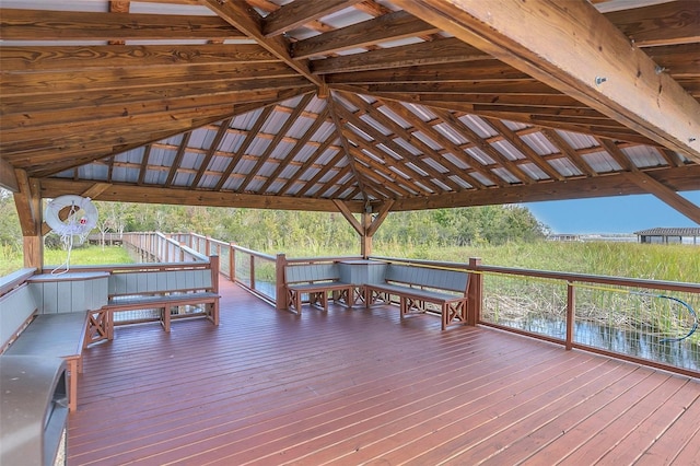 wooden deck with a water view