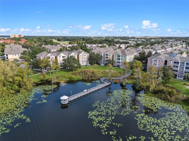 birds eye view of property with a residential view and a water view