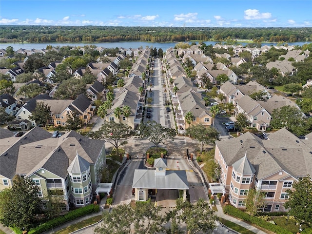 birds eye view of property featuring a water view and a residential view