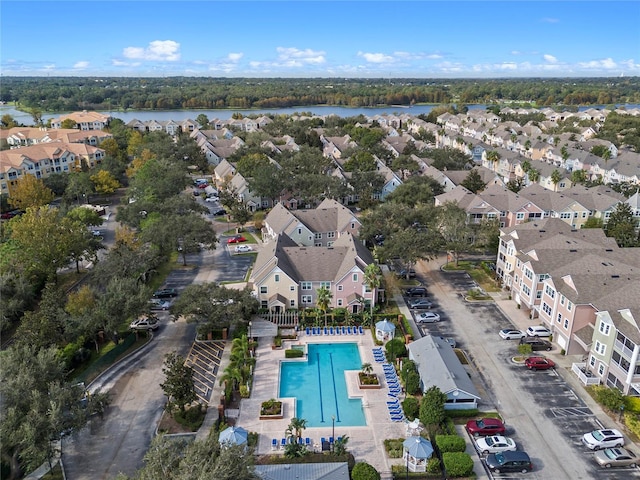 drone / aerial view featuring a residential view and a water view