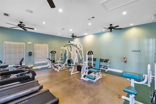 exercise room with ceiling fan