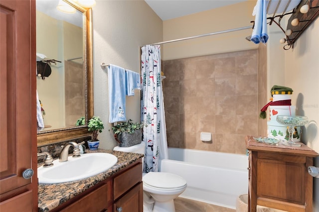 full bathroom featuring vanity, shower / tub combo, and toilet