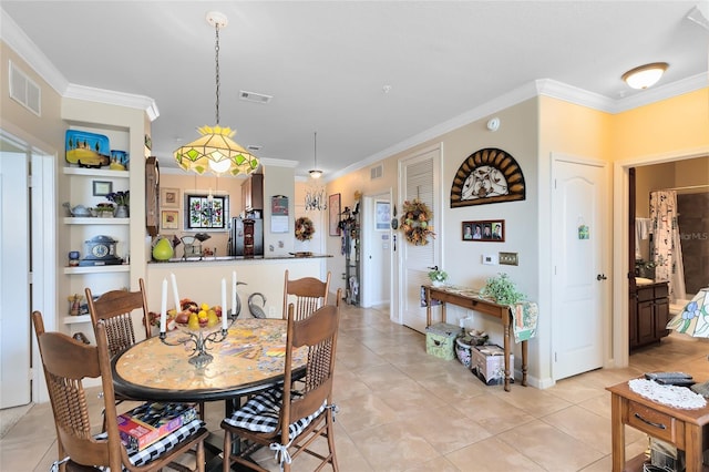 dining area with ornamental molding and light tile patterned floors