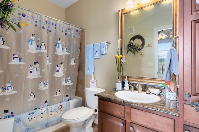 full bathroom featuring shower / bathtub combination with curtain, vanity, and toilet