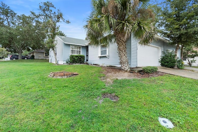 view of front of property featuring a garage and a front lawn