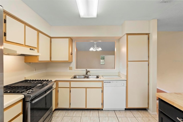 kitchen with sink, gas range, hanging light fixtures, a chandelier, and dishwasher