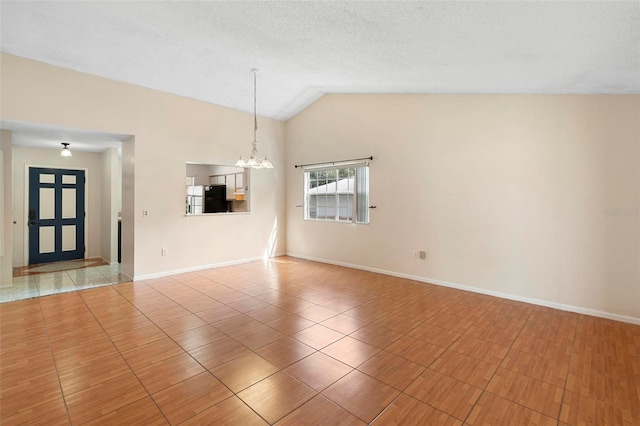 unfurnished room featuring lofted ceiling, tile patterned flooring, a notable chandelier, and a textured ceiling