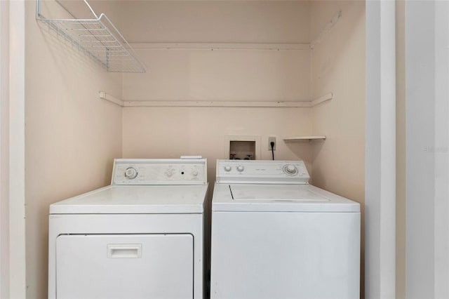 clothes washing area featuring washer and clothes dryer