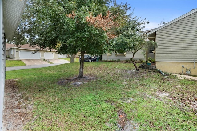 view of yard featuring a garage