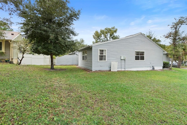 view of side of property with a yard