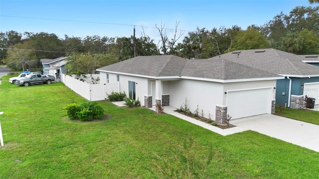 view of front facade featuring a front yard and a garage