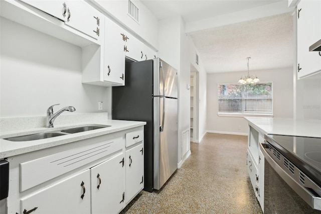 4221 Mizell St, Orlando, FL 32812 - kitchen featuring visible vents, a sink, appliances with stainless steel finishes, and white cabinets
