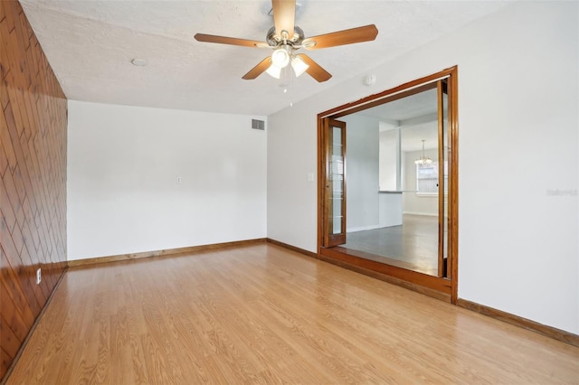 4221 Mizell St, Orlando, FL 32812 - spare room with baseboards, ceiling fan, wood finished floors, and visible vents