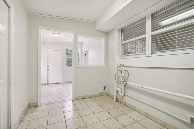 4221 Mizell St, Orlando, FL 32812 - washroom featuring baseboards and light tile patterned floors