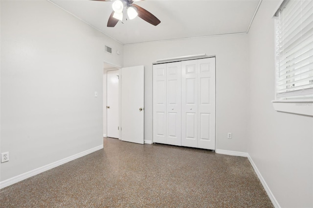 4221 Mizell St, Orlando, FL 32812 - unfurnished bedroom featuring speckled floor, baseboards, ceiling fan, and a closet